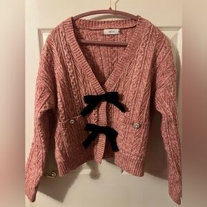 Pink Cable Knit Sweater with Velvet Bow Accents and Pearl Buttons